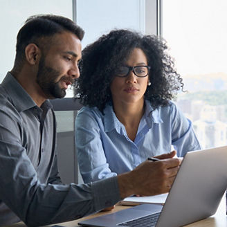 Colleagues looking at a screen