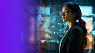 Long-haired woman wearing glasses facing a transparent digital screen displaying orange text on the left and blue interface lines and icons in the background