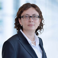 Blurred abstract background interior view looking out toward to empty office lobby and entrance doors and glass curtain wall with frame