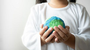 Child holding the planet earth