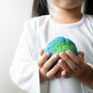 Child holding the planet earth