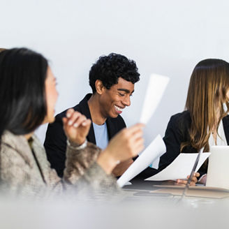 Entrepreneurs with document in meeting at office