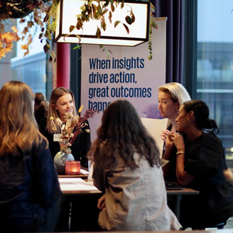 A group of happy female students talking