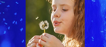 little girl with dandelion