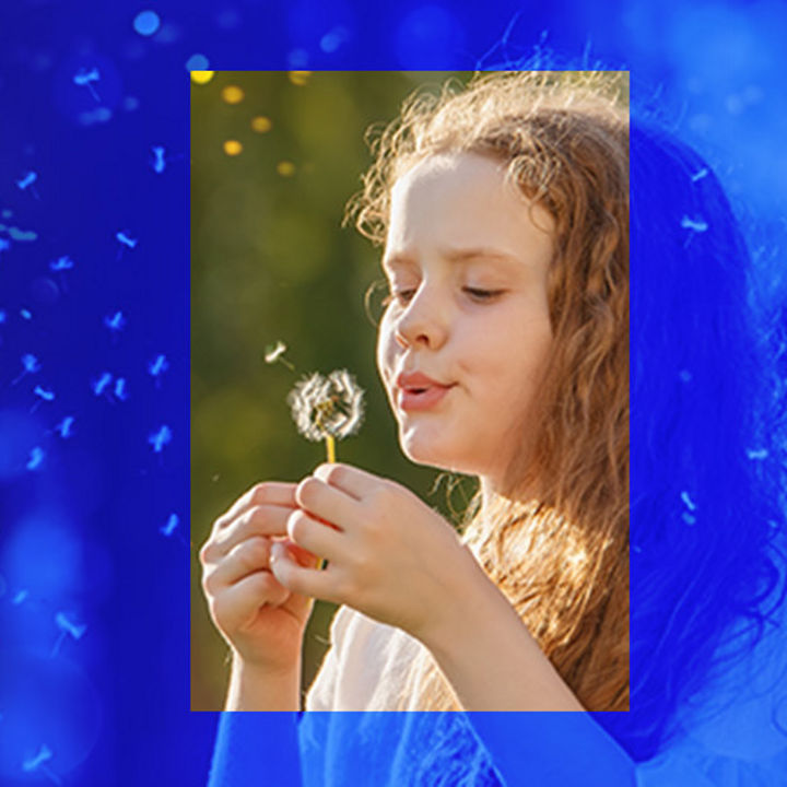 little girl with dandelion