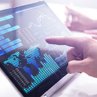 Finger touching screen with financial analytics