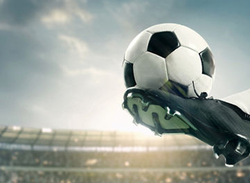 Banner. Soccer athlete performing high kick, striking soccer ball mid-air with precision, powerful motion captured against stadium backdrop. Concept of sport championship, match, tournament. Ad