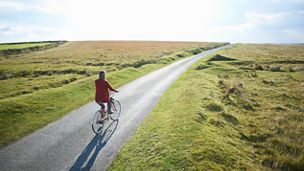 woman walking after road