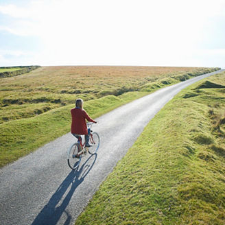woman walking after road