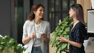 Women laughing together at work