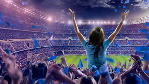 Fotografía de una afición celebrando en la tribuna de un estadio de futbol