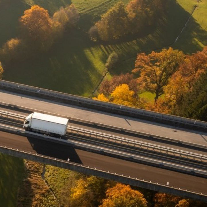 Aerial view of lorry on motorway bridge