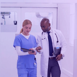 Healthcare professionals walking together in a hospital.