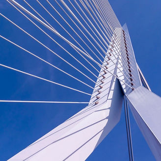 The 25 de Abril Bridge in Lisbon seen from afar on a clear day.