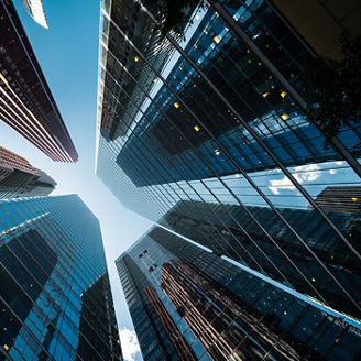 Glass skyscrapers towering above a city street