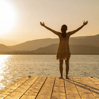 woman at seaside sunrise