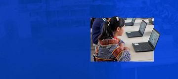 children working on laptops
