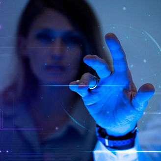 A man touching a transparent screen next to a woman	