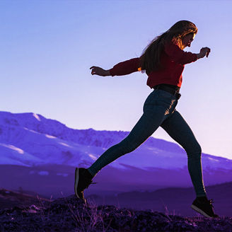 A woman jumping in the nature