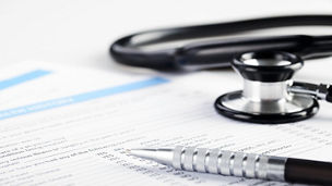 Stethoscope and a piece of paper