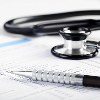 Stethoscope and a piece of paper