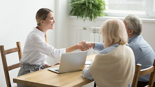 People around a table discussing 