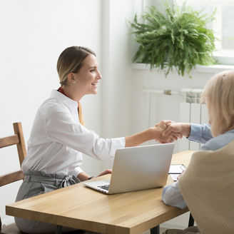 People around a table discussing 