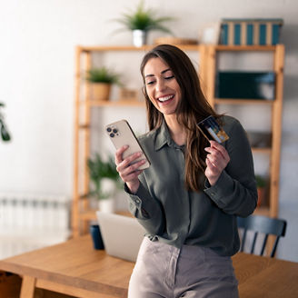 Girl smiling while looking at phone
