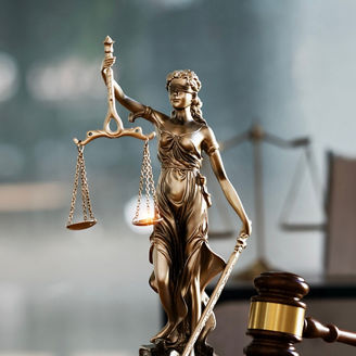 Lady justice with a law hammer and books