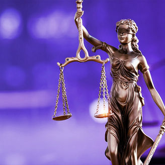 Lady justice with a law hammer and books