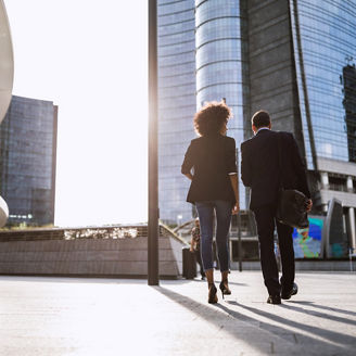 Handsome Couple Walking Home From Work In Streets Of Milan, Italy.