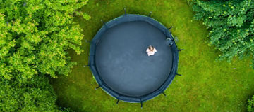 Top view child on trampoline