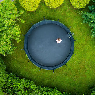 Top view child on trampoline