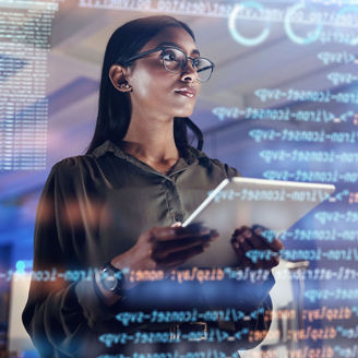 Woman looking a screen holding a tablet