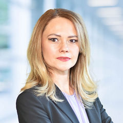 Blurred abstract background interior view looking out toward to empty office lobby and entrance doors and glass curtain wall with frame