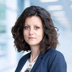 Blurred abstract background interior view looking out toward to empty office lobby and entrance doors and glass curtain wall with frame