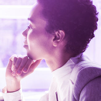 Woman watching data in front of her laptop