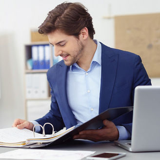 Man working on files with a computer