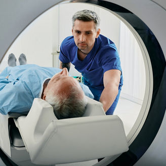 A nurse helps a patient in MRI machine to test