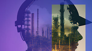 A factory in the shape of a head with a safety helmet