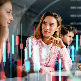 Group of business people working at modern office.Technical price graph and indicator, red and blue candlestick chart and stock trading computer screen background. Double exposure. Traders analyzing data.