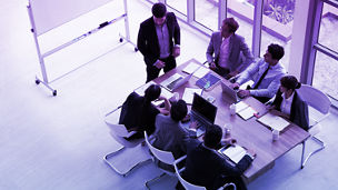 people having a meeting in office