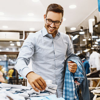 man choosing shirts