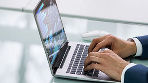 Man typing on laptop