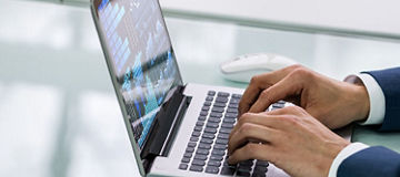 Man typing on laptop