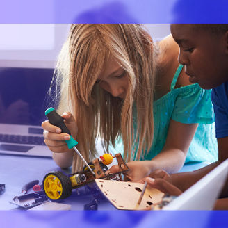 There are two children busy tinkering with a tractor
