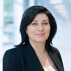 Blurred abstract background interior view looking out toward to empty office lobby and entrance doors and glass curtain wall with frame