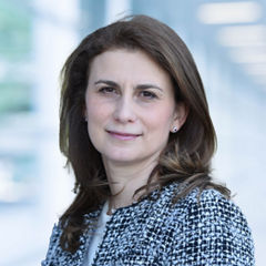 Blurred abstract background interior view looking out toward to empty office lobby and entrance doors and glass curtain wall with frame