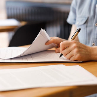 Someone is signing papers