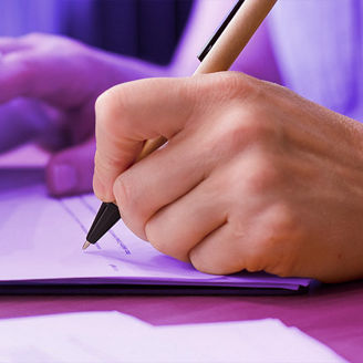 Someone is signing papers